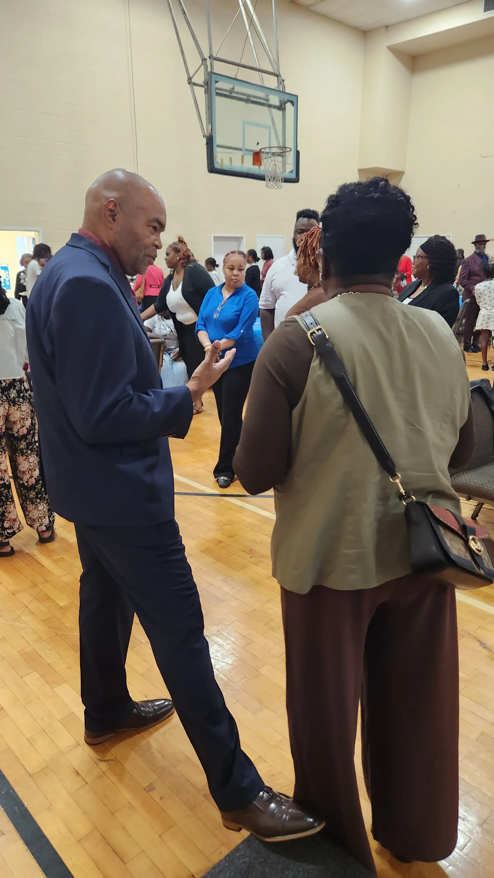 Two members talking together at a church fellowship gathering