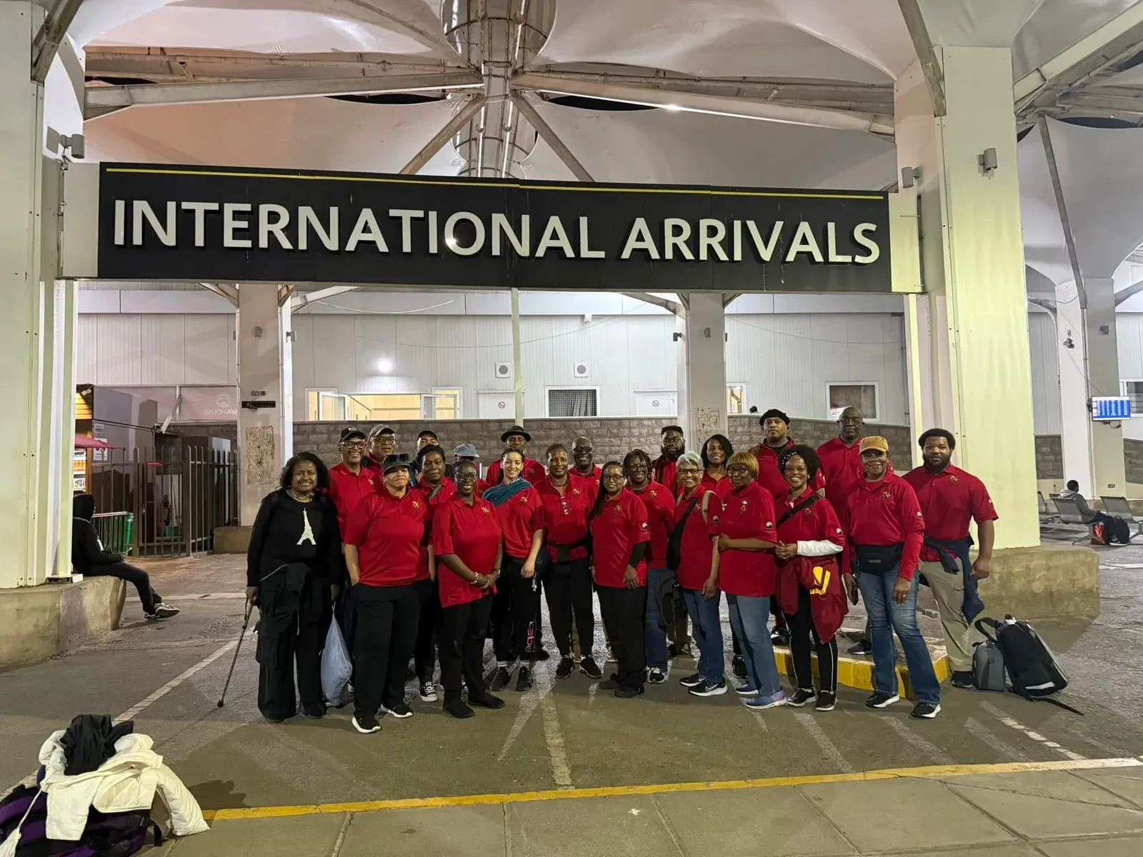 The mission team in matching red shirts at the international arrivals hall in Kenya