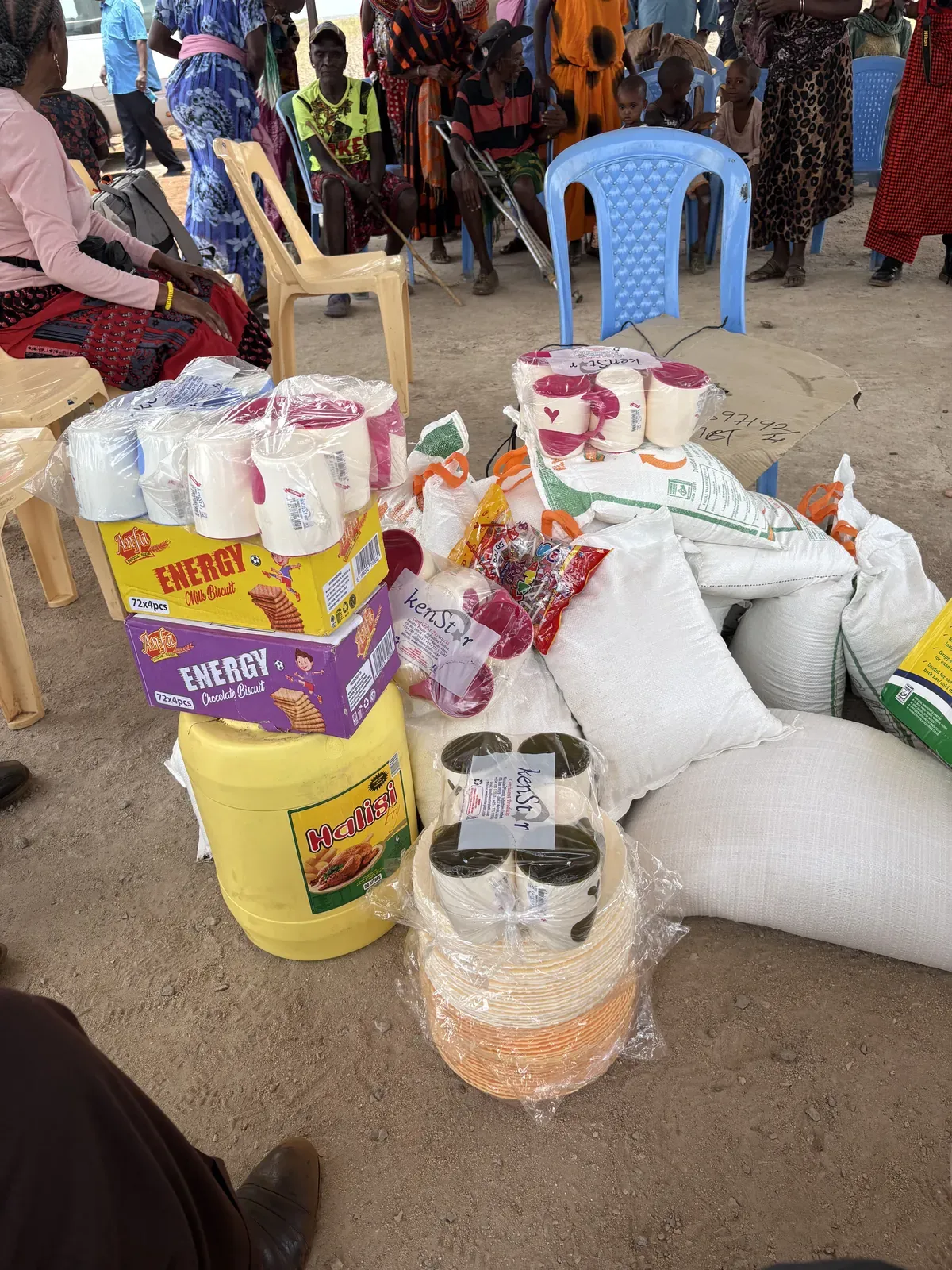 Sacks of grain, cooking oil, water and food parcels stacked ready to be handed out