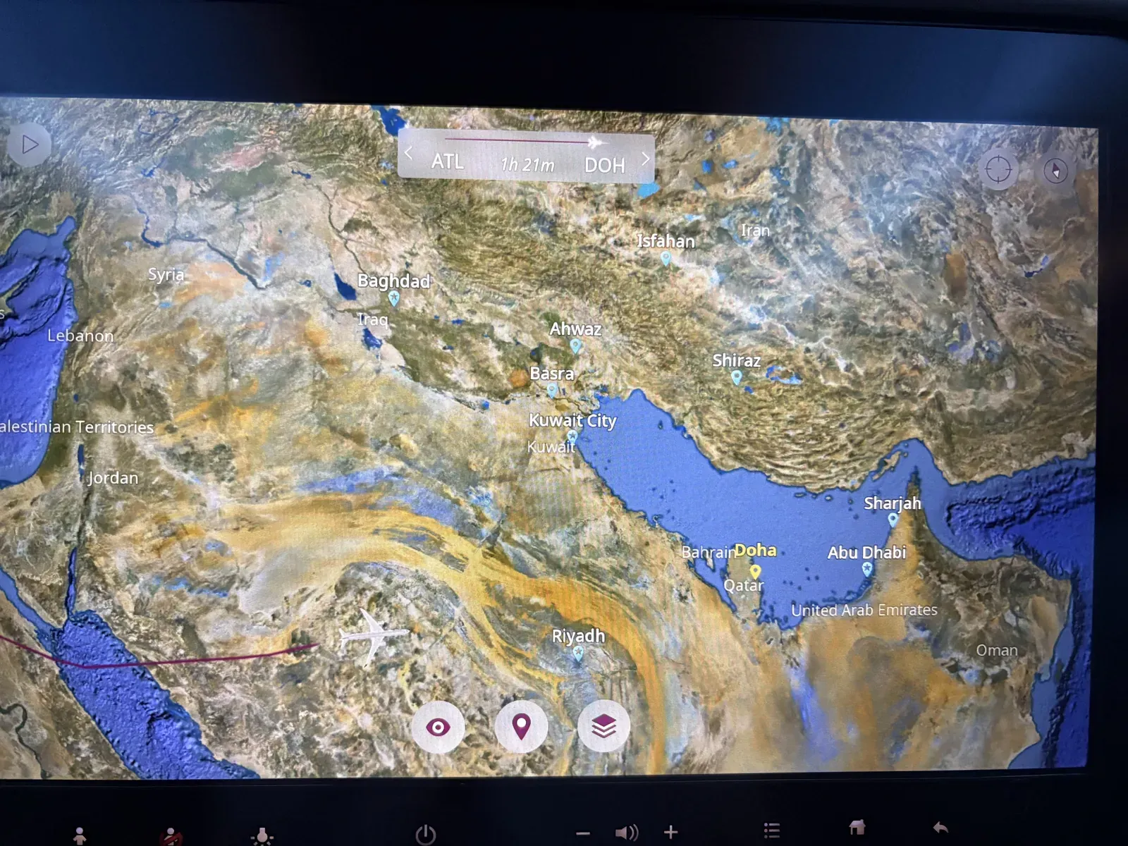 The in-flight map screen showing the route across the Gulf on the way home