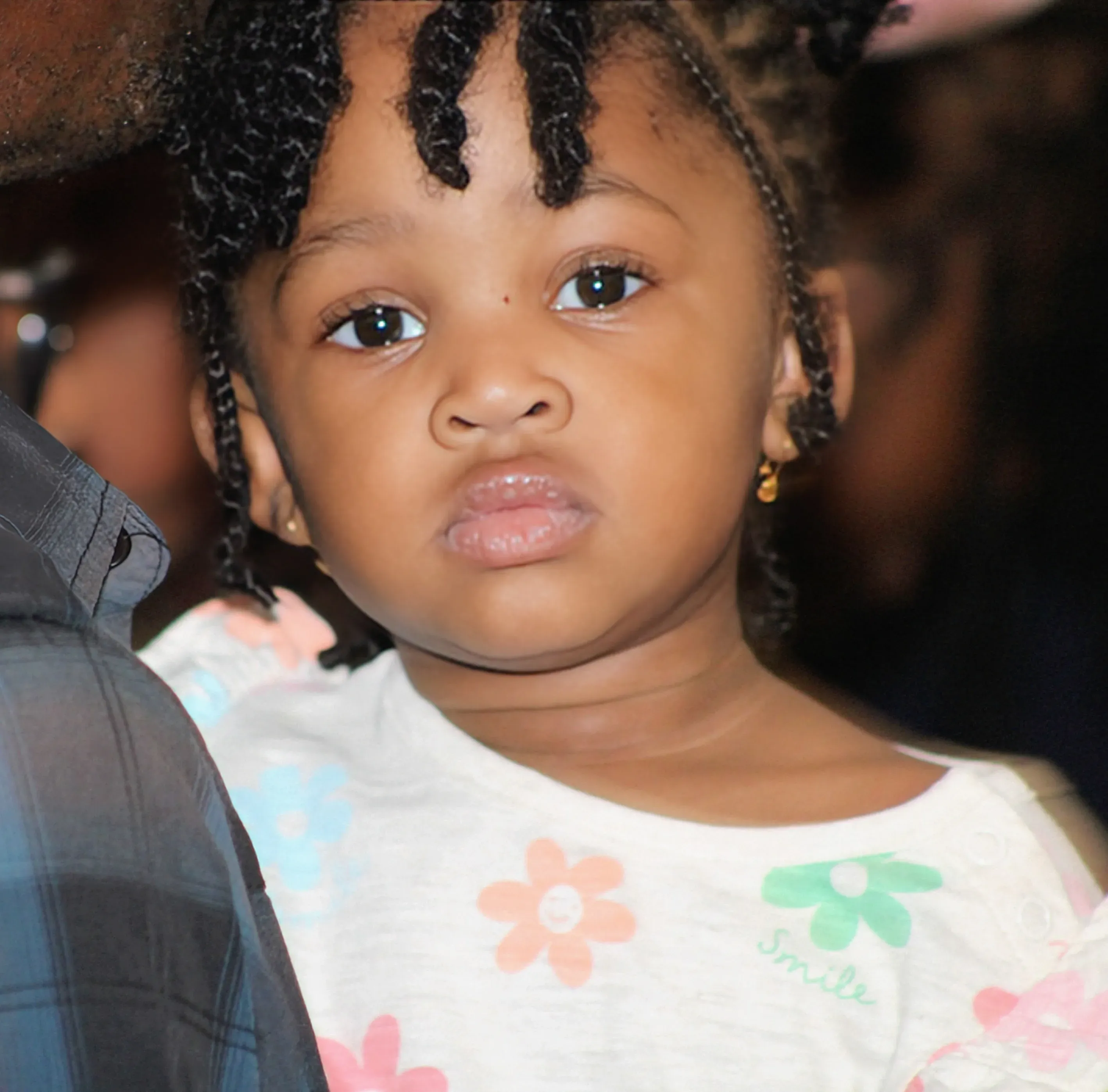 A young child held in the sanctuary during a service