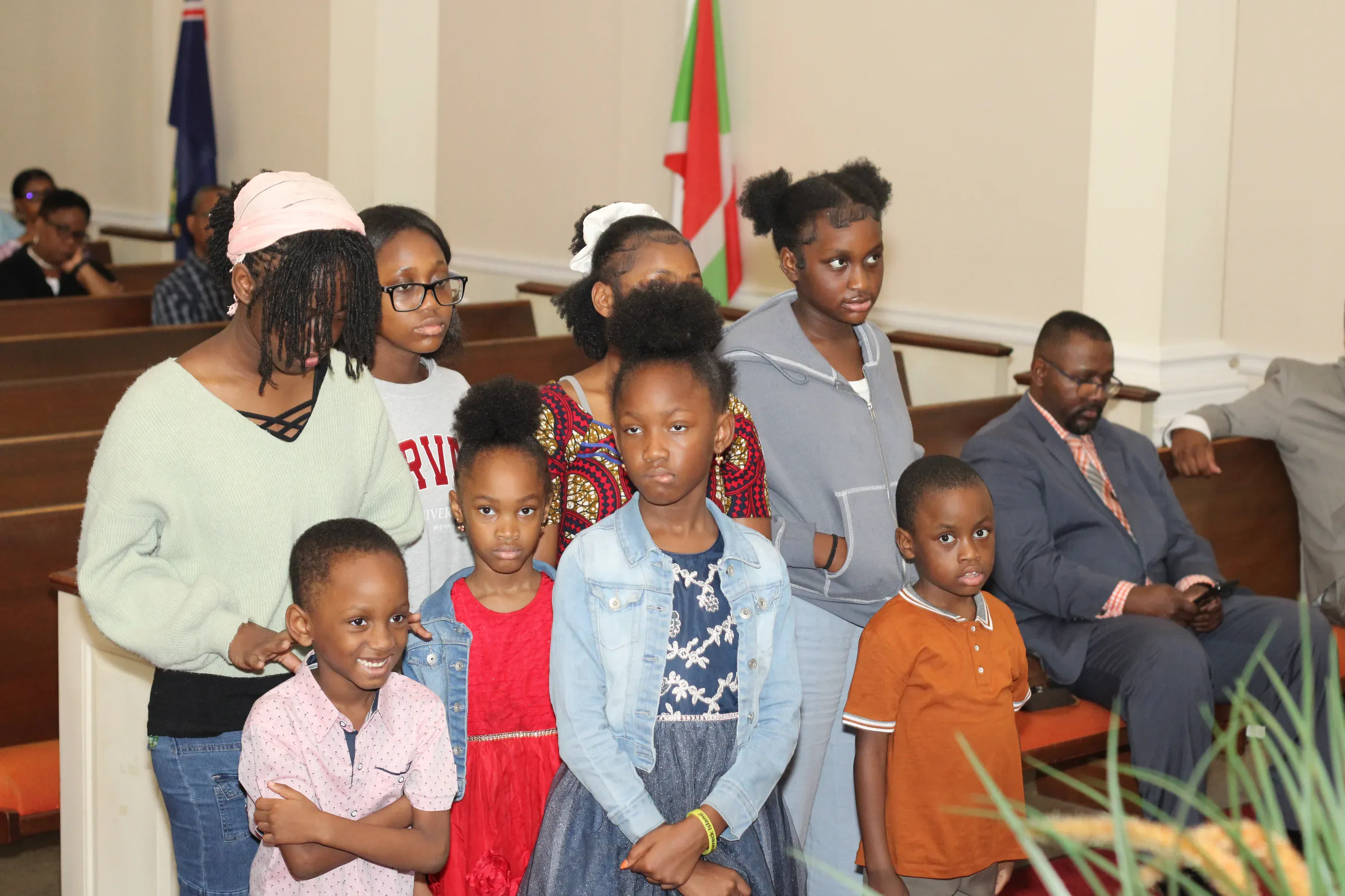 Children and teens standing together at the front of the sanctuary