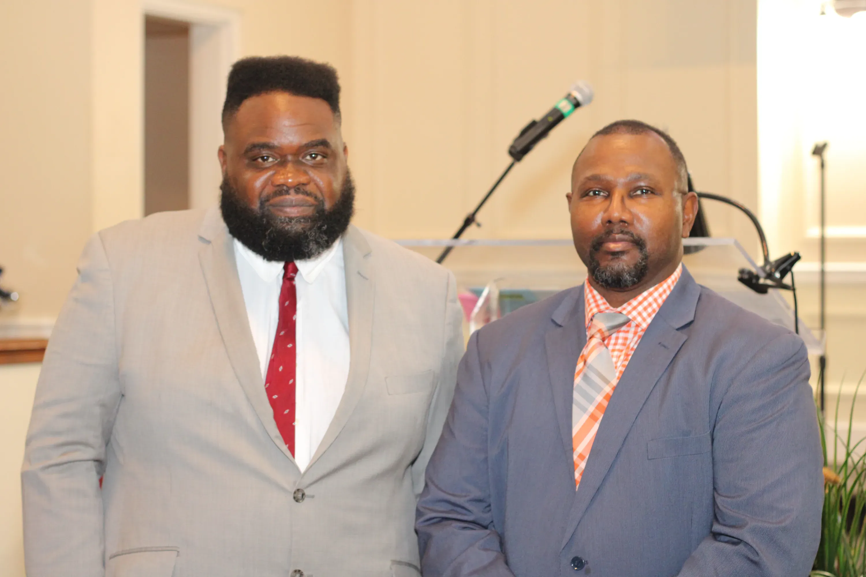 Two church leaders at the front of the sanctuary